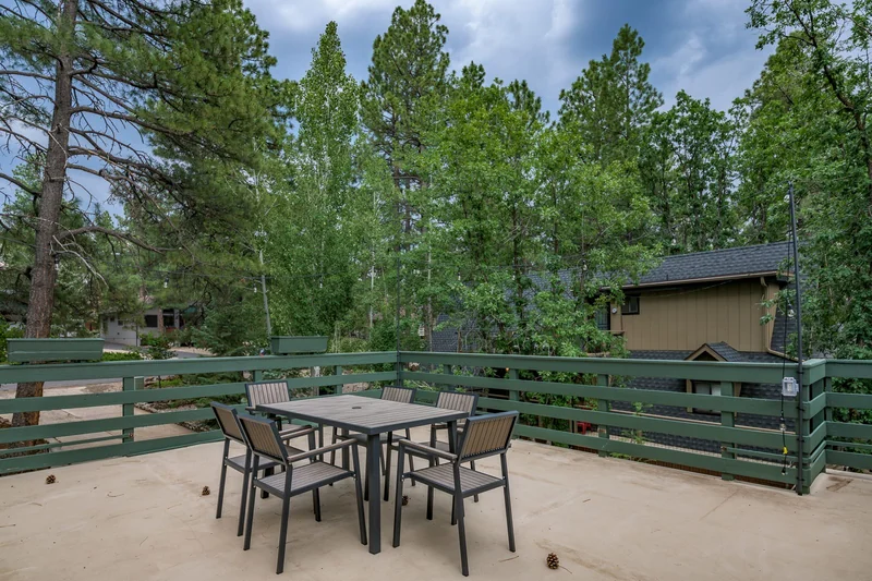 Deck and roofline among the pines