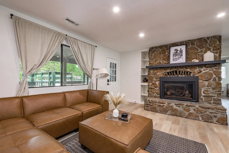 Living room with new stone fireplace surround