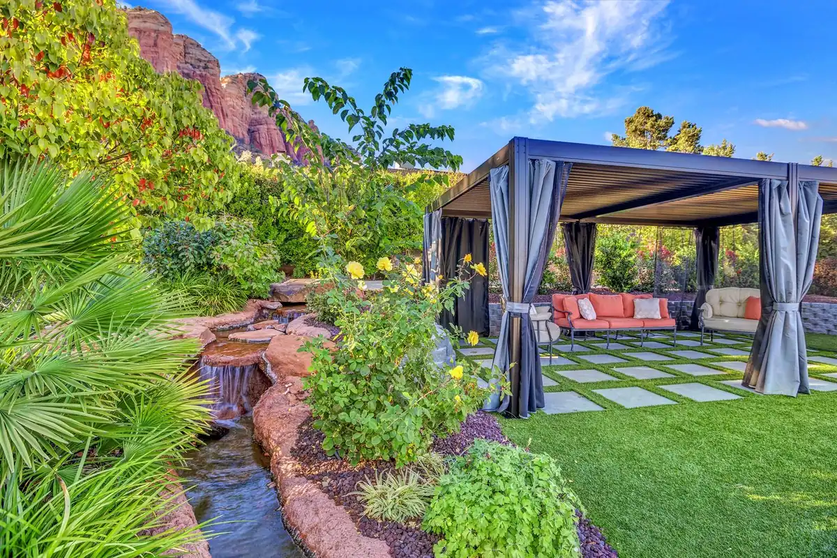 Backyard pond and stone patio feature